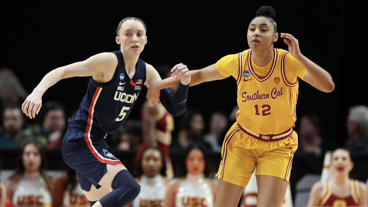 PORTLAND, OREGON - APRIL 01: Paige Bueckers #5 of the Connecticut Huskies defends JuJu Watkins #12 of the USC Trojans during the second half in the Elite 8 round of the NCAA Women's Basketball Tournament at Moda Center on April 01, 2024 in Portland, Oregon.
