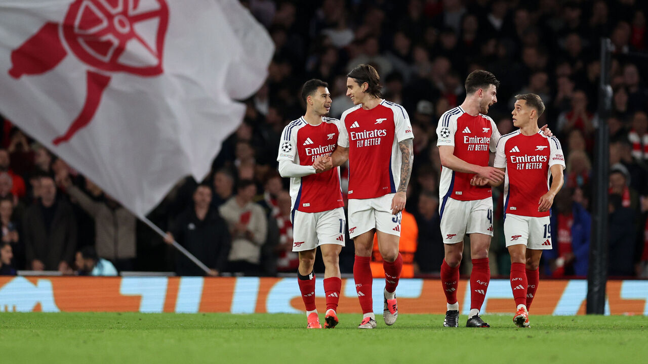 LONDON, ENGLAND - OCTOBER 22: Gabriel Martinelli of Arsenal celebrates after scoring a goal to make it 1-0 with Riccardo Calafiori of Arsenal during the UEFA Champions League 2024/25 League Phase MD3 match between Arsenal FC and FC Shakhtar Donetsk at Emirates Stadium on October 22, 2024 in London, England.