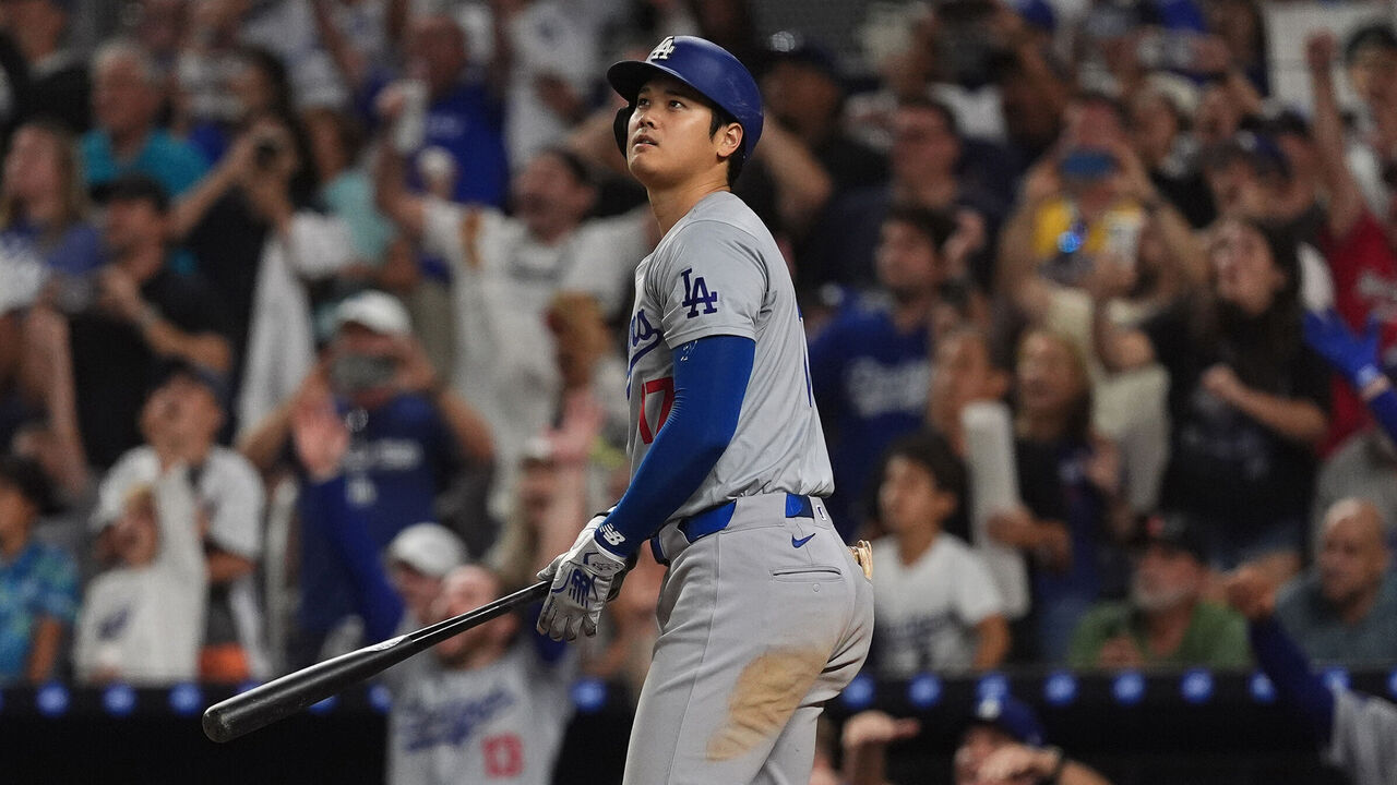 MIAMI, FLORIDA - SEPTEMBER 19: Shohei Ohtani #17 of the Los Angeles watches the ball after hitting his 50th Home Run of the season in the game against the Miami Marlins at loanDepot park on September 19, 2024 in Miami, Florida.