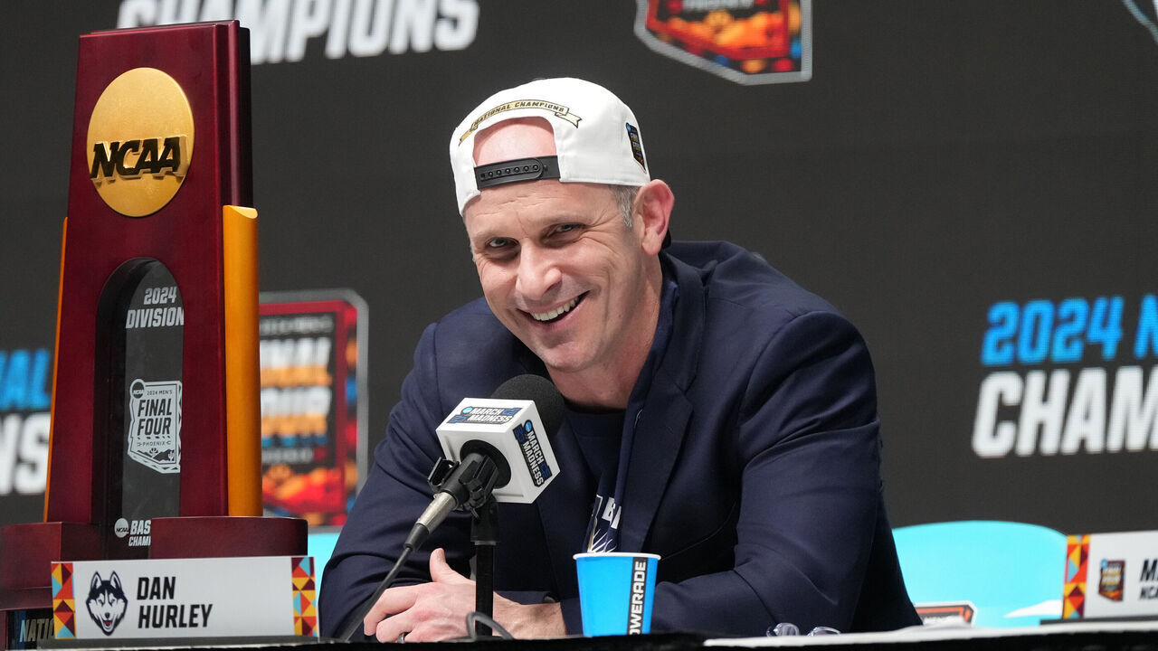 GLENDALE, ARIZONA - APRIL 08: Head coach Dan Hurley of the Connecticut Huskies addresses the media after the National College Basketball Championship game against the Purdue Boilermakers at State Farm Stadium on April 08, 2024 in Glendale, Arizona.