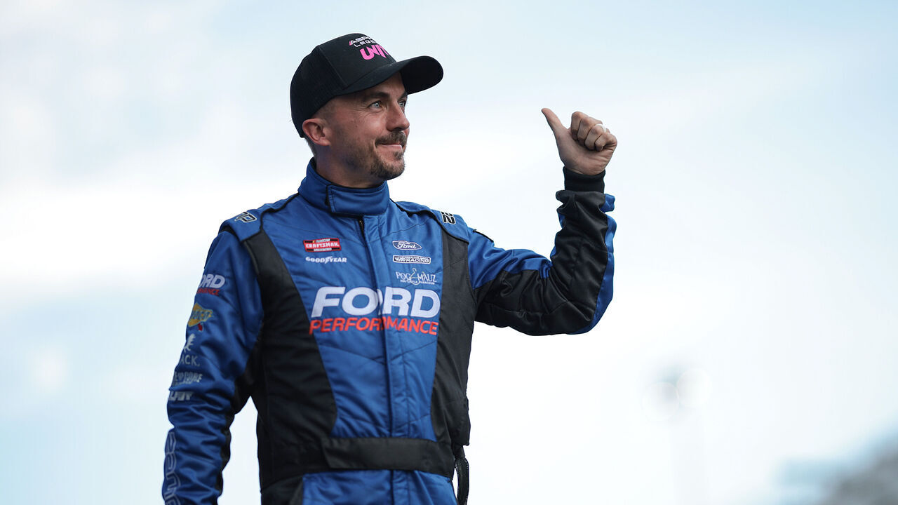 LEBANON, TENNESSEE - JUNE 28: Frankie Muniz, driver of the #22 Ford Performance Ford, walks onstage during driver intros prior to the NASCAR Craftsman Truck Series Rackley Roofing 200 at Nashville Superspeedway on June 28, 2024 in Lebanon, Tennessee.
