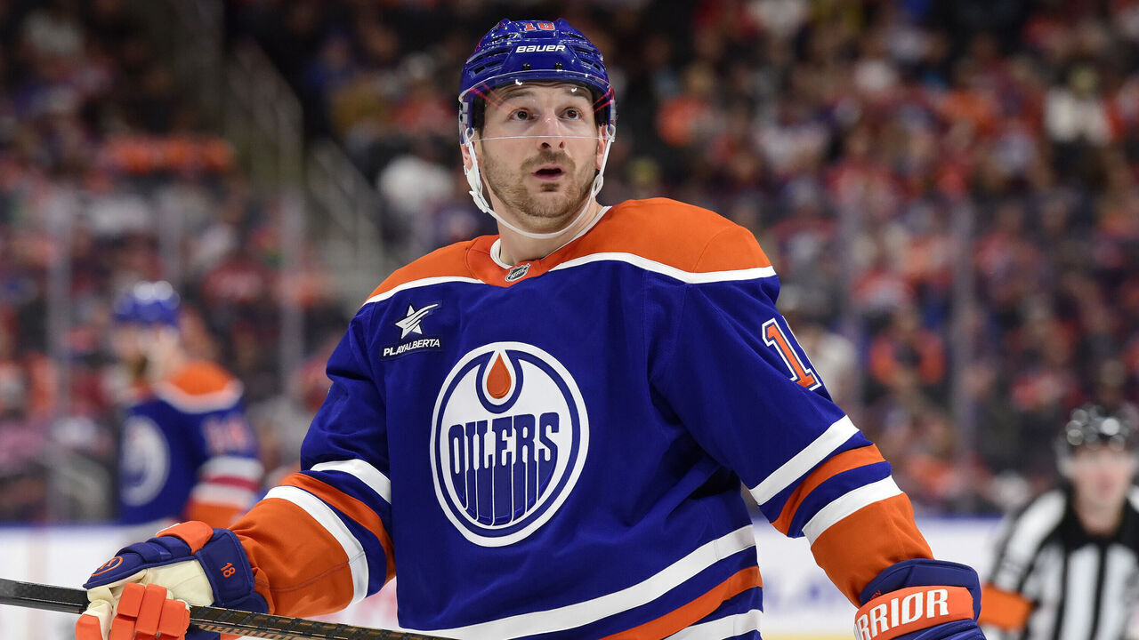 EDMONTON, CANADA OCTOBER 12: Zach Hyman #18 of the Edmonton Oilers glances in the crowd as he awaits a face-off during the game against the Chicago Blackhawks at Rogers Place on October 12, 2024, in Edmonton, Alberta, Canada.
