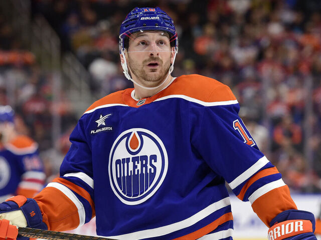 EDMONTON, CANADA OCTOBER 12: Zach Hyman #18 of the Edmonton Oilers glances in the crowd as he awaits a face-off during the game against the Chicago Blackhawks at Rogers Place on October 12, 2024, in Edmonton, Alberta, Canada.