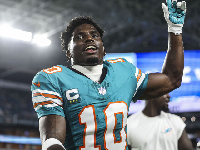 MIAMI GARDENS, FL - SEPTEMBER 12: Tyreek Hill #10 of the Miami Dolphins looks on prior to an NFL football game against the Buffalo Bills at Hard Rock Stadium on September 12, 2024 in Miami Gardens, FL.