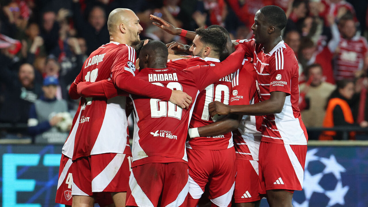 TOPSHOT - Brest's players celebrate after scoring their first goal during the UEFA Champions League 1st round day 3 football match between Brest (FRA) and Bayer Leverkusen (GER) at the Stade de Roudourou in Guingamp, northern France, on October 23, 2024.