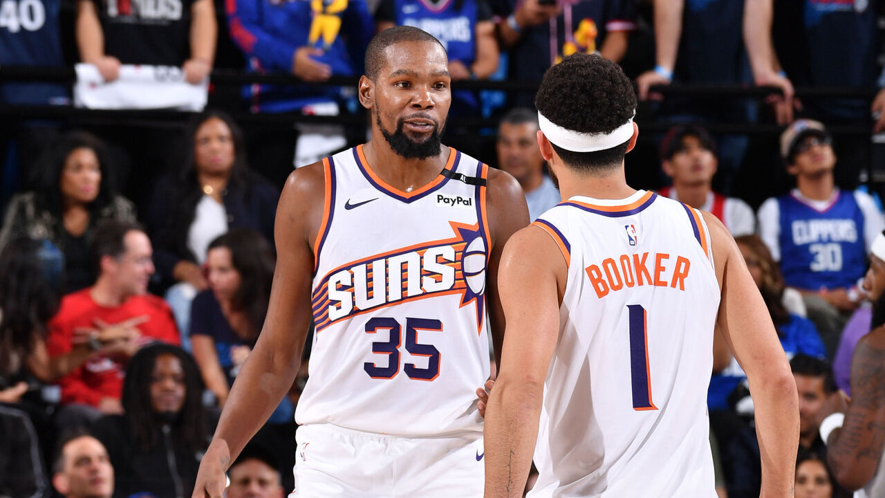 INGLEWOOD, CA - OCTOBER 23: Kevin Durant #35 and Devin Booker #1 of the Phoenix Suns talk during the game against the LA Clippers on October 23, 2024 at Intuit Dome in Los Angeles, California. NOTE TO USER: User expressly acknowledges and agrees that, by downloading and/or using this Photograph, user is consenting to the terms and conditions of the Getty Images License Agreement. Mandatory Copyright Notice: Copyright 2024 NBAE