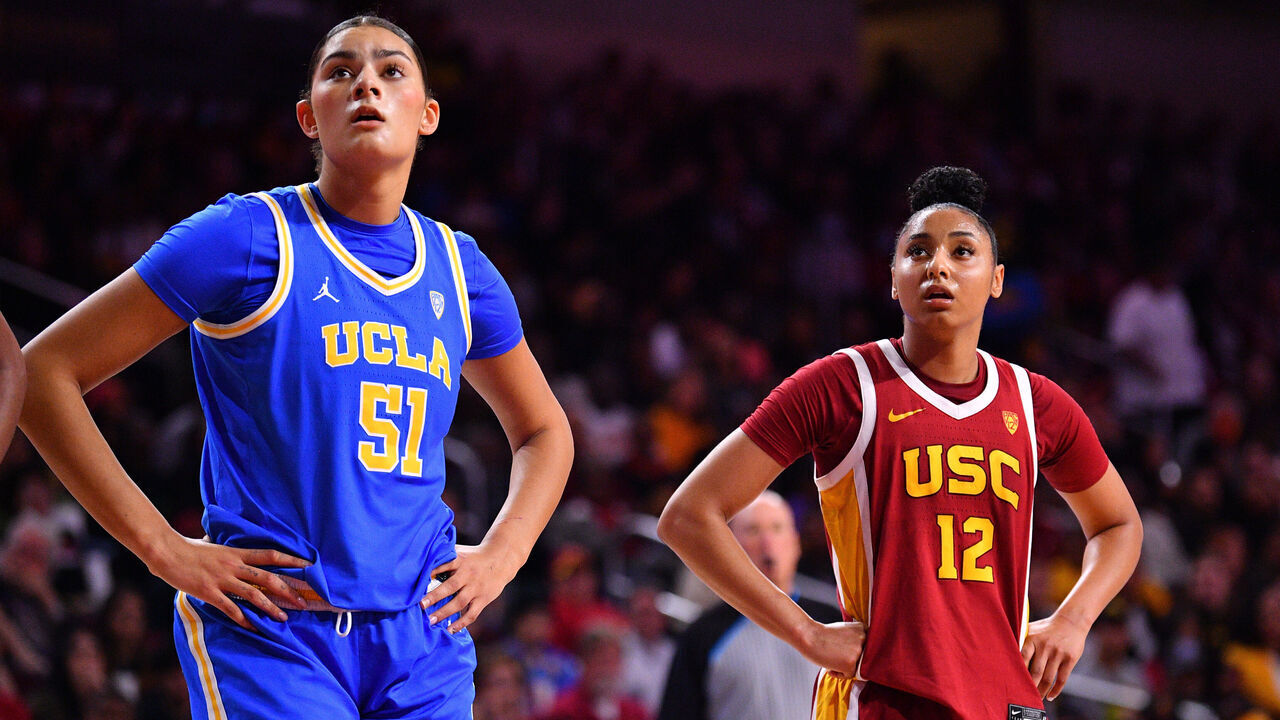 LOS ANGELES, CA - JANUARY 14: UCLA Bruins center Lauren Betts (51) looks on with USC Trojans guard JuJu Watkins (12) during the women's college basketball game between the UCLA Bruins and the USC Trojans on January 14, 2024 at Galen Center in Los Angeles, CA.