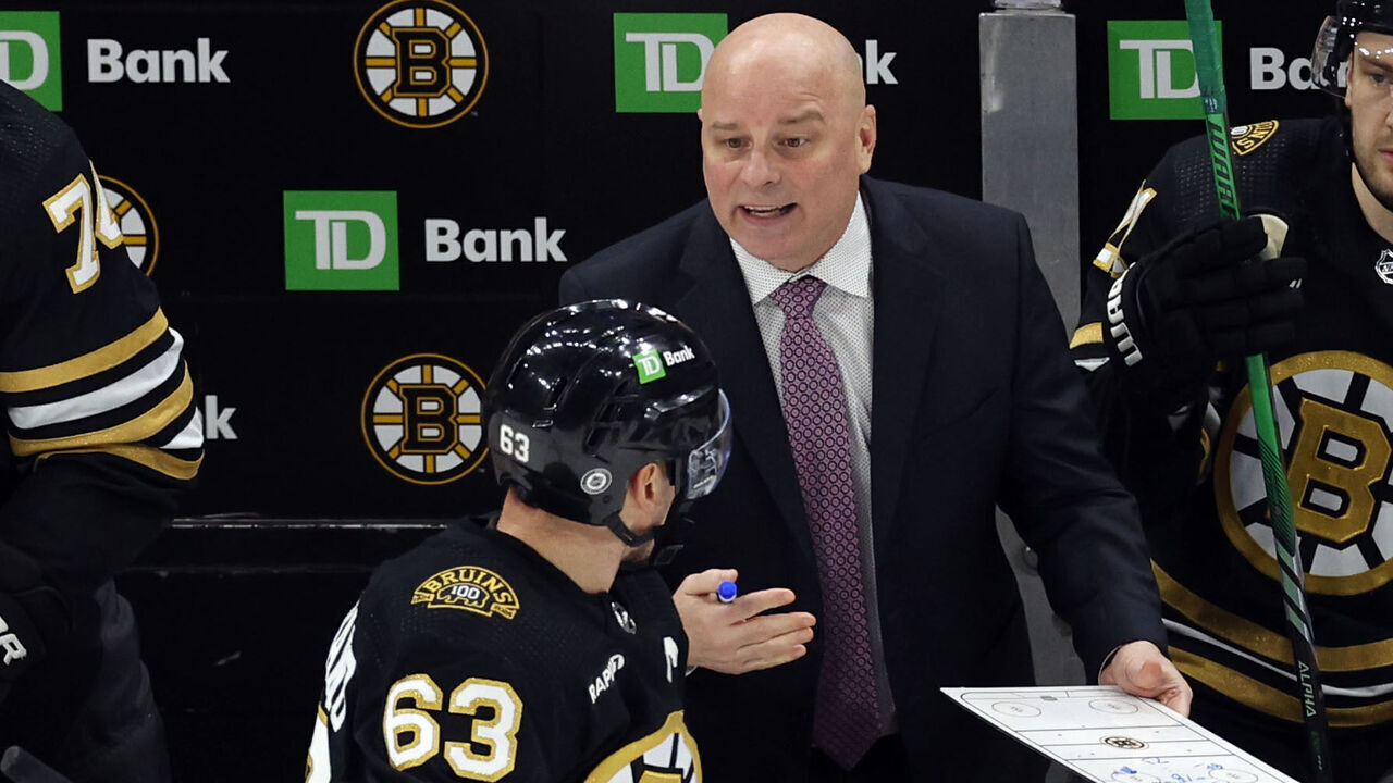 Boston, MA - January 24: Boston Bruins head coach Jim Montgomery talks to LW Brad Marchand during a third period timeout. The Bruins lost to the Carolina Hurricanes, 3-2.