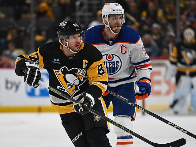 PITTSBURGH, PENNSYLVANIA - MARCH 10: Sidney Crosby #87 of the Pittsburgh Penguins skates against Connor McDavid #97 of the Edmonton Oilers in the third period during the game at PPG PAINTS Arena on March 10, 2024 in Pittsburgh, Pennsylvania.