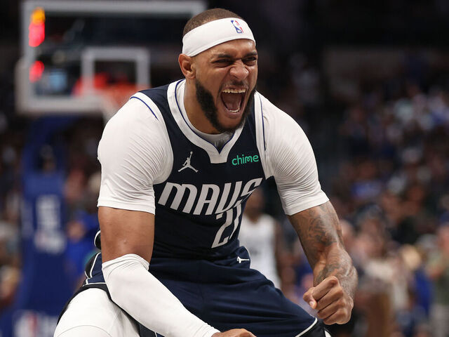 DALLAS, TEXAS - OCTOBER 24: Daniel Gafford #21 of the Dallas Mavericks celebrates a score against the San Antonio Spurs during the third quarter at American Airlines Center on October 24, 2024 in Dallas, Texas.