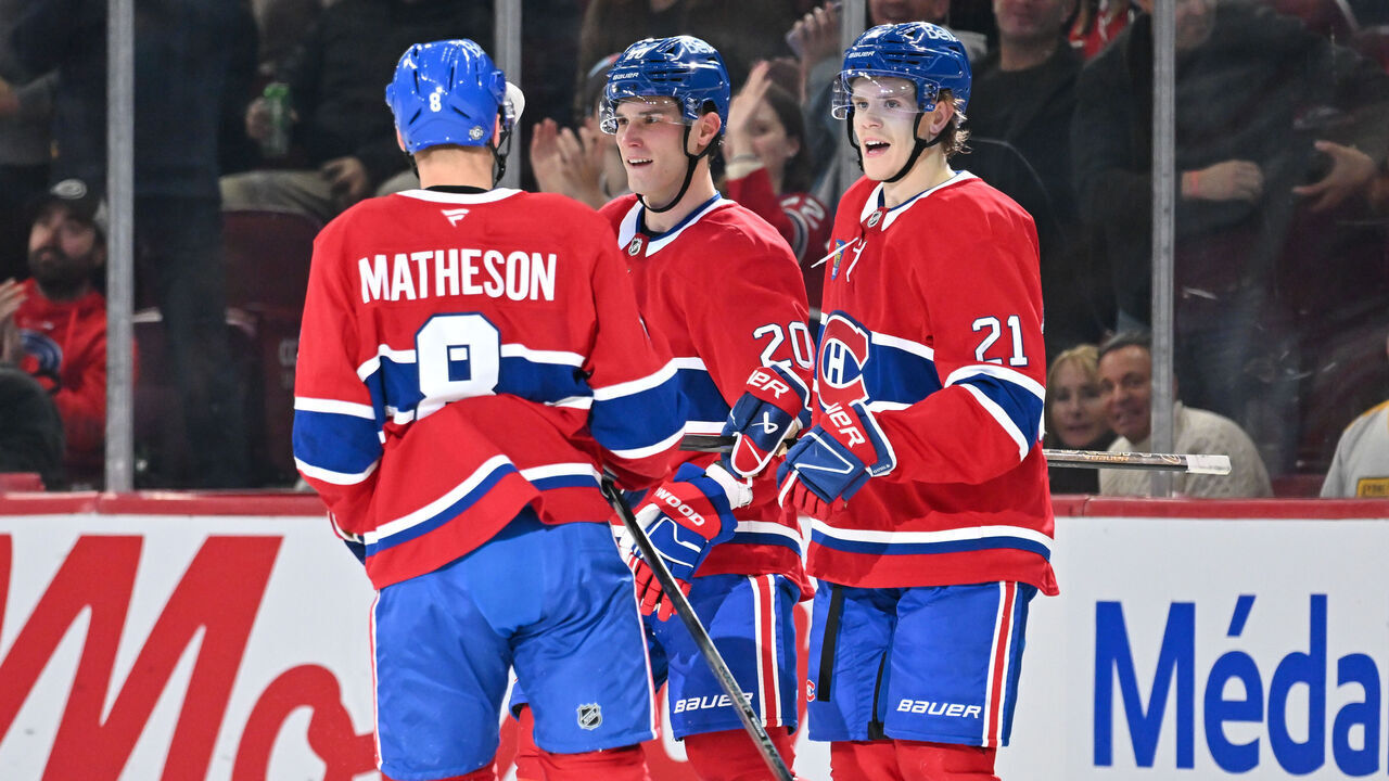 MONTREAL, CANADA - OCTOBER 14: Kaiden Guhle #21 of the Montreal Canadiens celebrates his goal with teammates Mike Matheson #8 and Juraj Slafkovsky #20 during the first period against the Pittsburgh Penguins at the Bell Centre on October 14, 2024 in Montreal, Quebec, Canada.