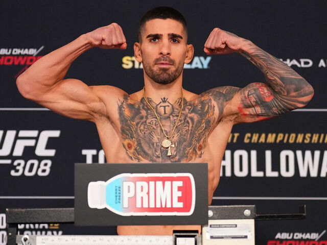 ABU DHABI, UNITED ARAB EMIRATES - OCTOBER 25: Ilia Topuria of Spain poses on the scale during the UFC 308 official weigh-in at The Hilton Yas Island on October 25, 2024 in Abu Dhabi, United Arab Emirates.