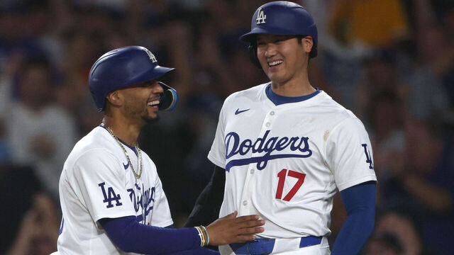 LOS ANGELES, CALIFORNIA - AUGUST 28: Shohei Ohtani #17 and Mookie Betts #50 of the Los Angeles Dodgers reacts to their run from a Teoscar Hernández #37 three run home run, to take a 5-3 lead over the Baltimore Orioles, during the third inning at Dodger Stadium on August 28, 2024 in Los Angeles, California.