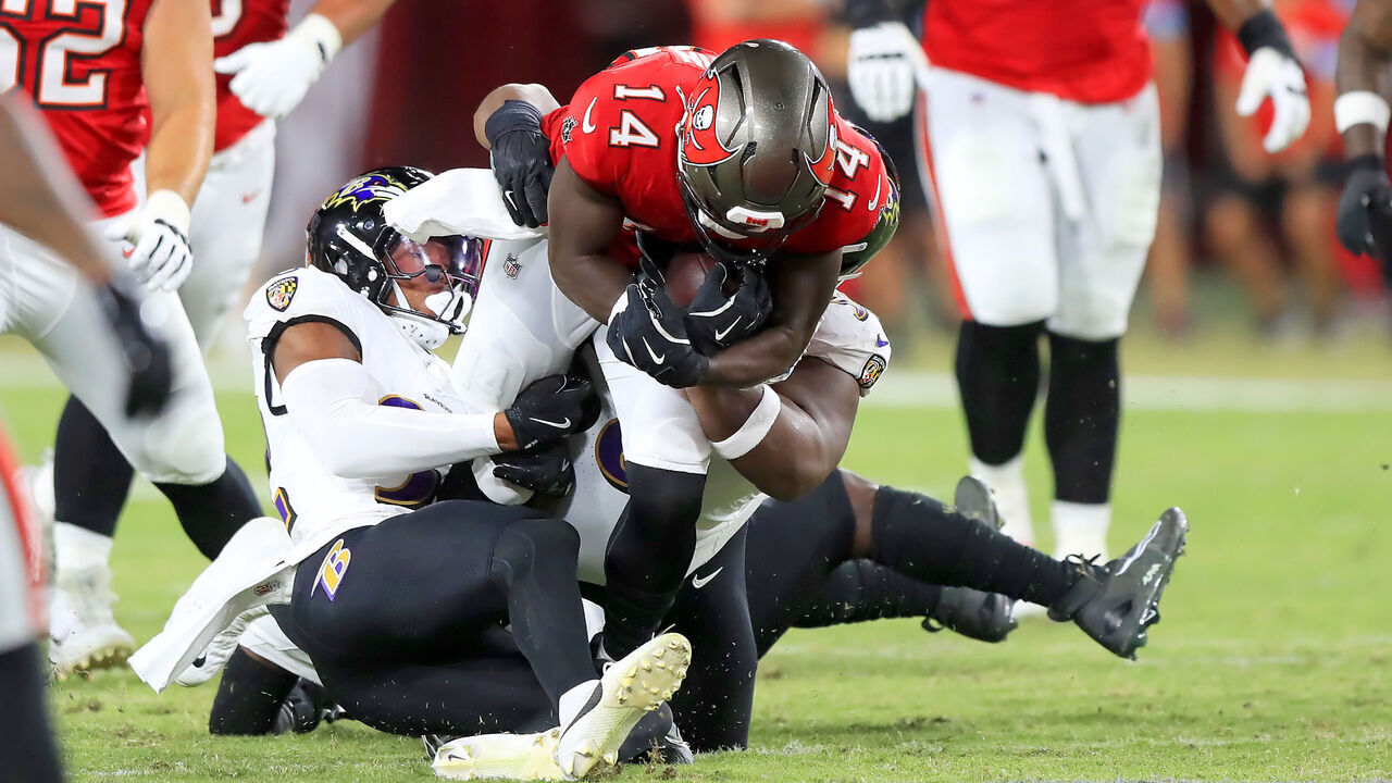 TAMPA, FL - OCTOBER 21: Tampa Bay Buccaneers wide receiver Chris Godwin (14) dives for additional yards during the game between the Baltimore Ravens and the Tampa Bay Buccaneers on October 21, 2024 at Raymond James Stadium in Tampa, Florida.