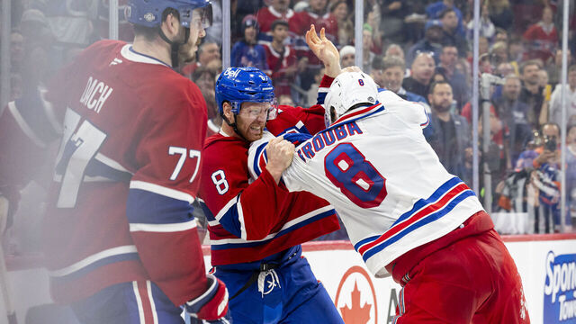 MONTREAL, CANADA- OCTOBER 22: Mike Matheson #8 of the Montreal Canadiens fights with Jacob Trouba #8 of the New York Rangers during the third period of the NHL regular season game between the Montreal Canadiens and the New York Rangers at the Bell Centre on October 22, 2024 in Montreal, Quebec, Canada.