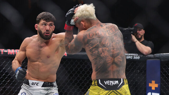 LAS VEGAS, NEVADA - APRIL 13: Charles Oliveira of Brazil exchanges strikes with Arman Tsarukyan in their lightweight fight at T-Mobile Arena on April 13, 2024 in Las Vegas, Nevada.