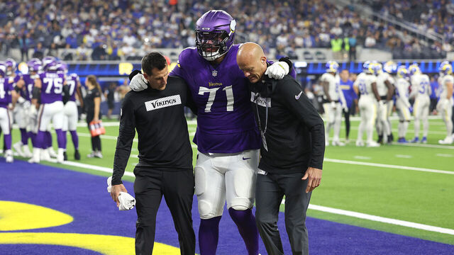 INGLEWOOD, CALIFORNIA - OCTOBER 24: Christian Darrisaw #71 of the Minnesota Vikings is helped off the field in the second quarter against the Los Angeles Rams at SoFi Stadium on October 24, 2024 in Inglewood, California.