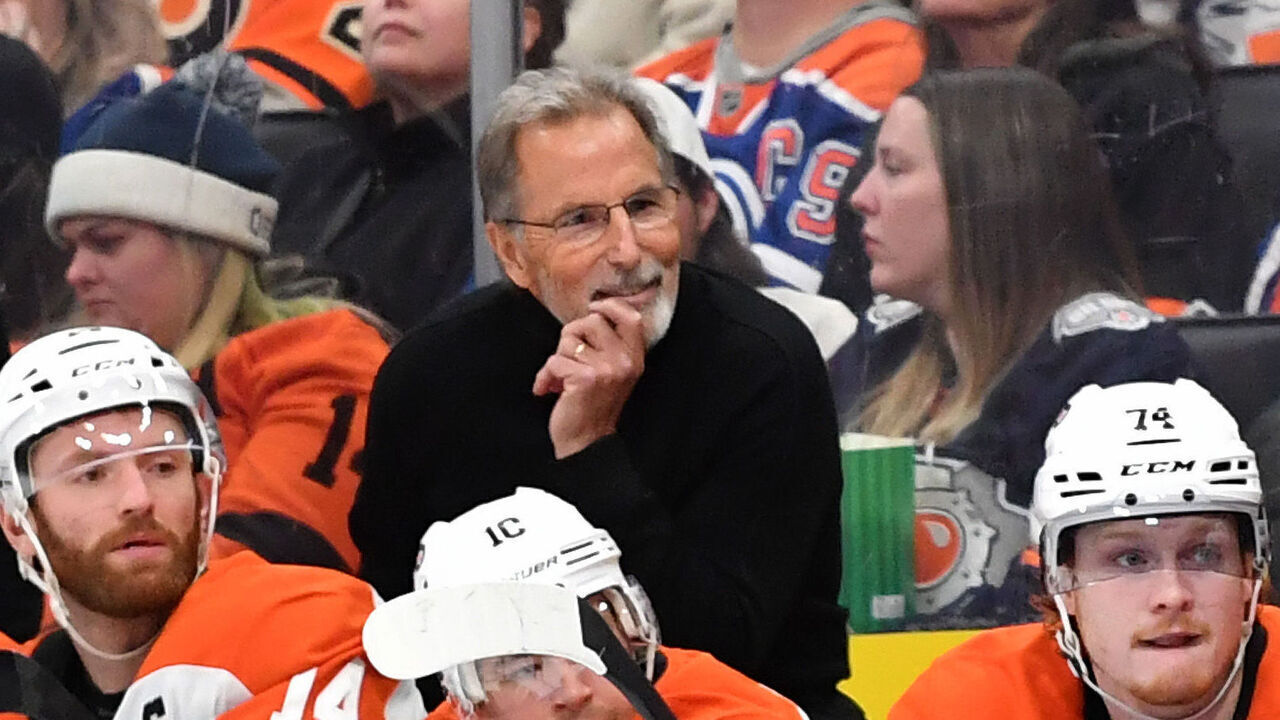 EDMONTON, CANADA - OCTOBER 15: Referee Garrett Rank #7 and Philadelphia Flyers head coach John Tortorella look on during the third period of the game at Rogers Place on October 15, 2024, in Edmonton, Alberta, Canada.