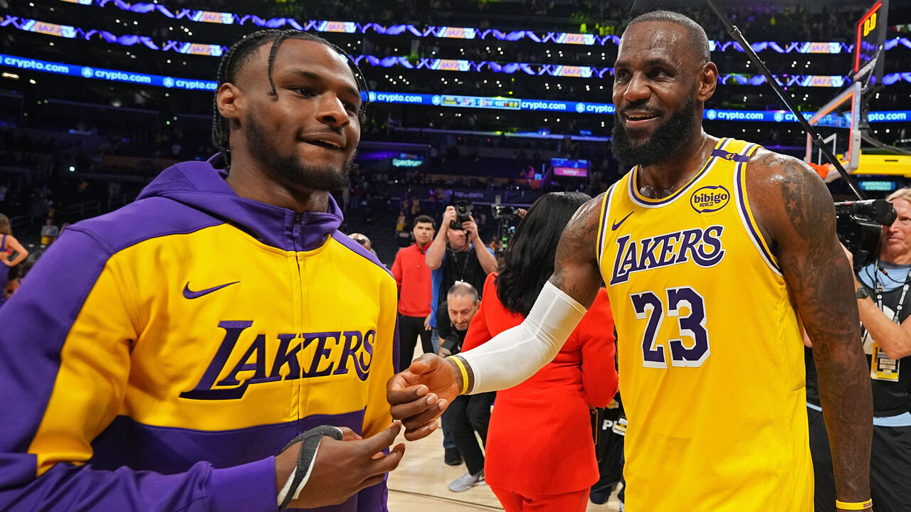 LOS ANGELES, CA - OCTOBER 22: Bronny James #9 and LeBron James #23 of the Los Angeles Lakers high five after the game against the Minnesota Timberwolves on October 22, 2024 at Crypto.Com Arena in Los Angeles, California. NOTE TO USER: User expressly acknowledges and agrees that, by downloading and/or using this Photograph, user is consenting to the terms and conditions of the Getty Images License Agreement. Mandatory Copyright Notice: Copyright 2024 NBAE