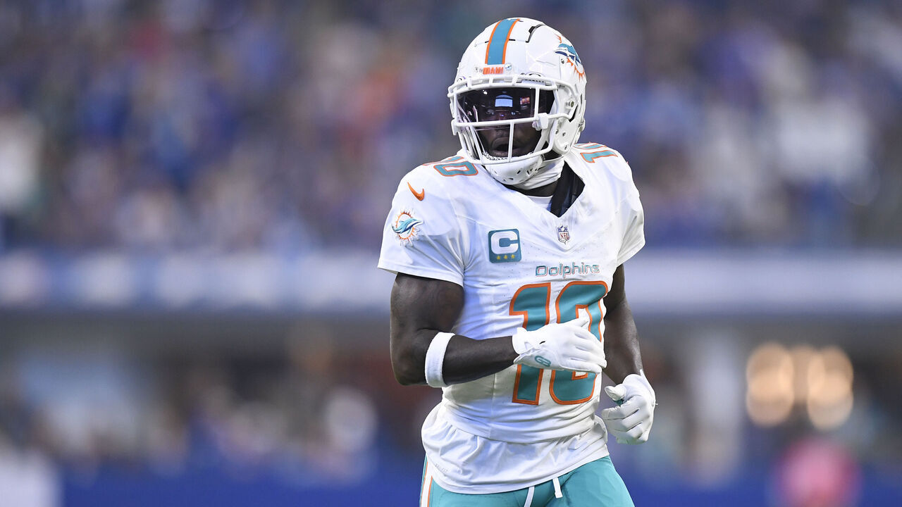 INDIANAPOLIS, IN - OCTOBER 20: Miami Dolphins Wide Receiver Tyreek Hill (10) jogs across the field during the NFL game between the Miami Dolphins and the Indianapolis Colts on October 20, 2024, at Lucas Oil Stadium in Indianapolis, Indiana.