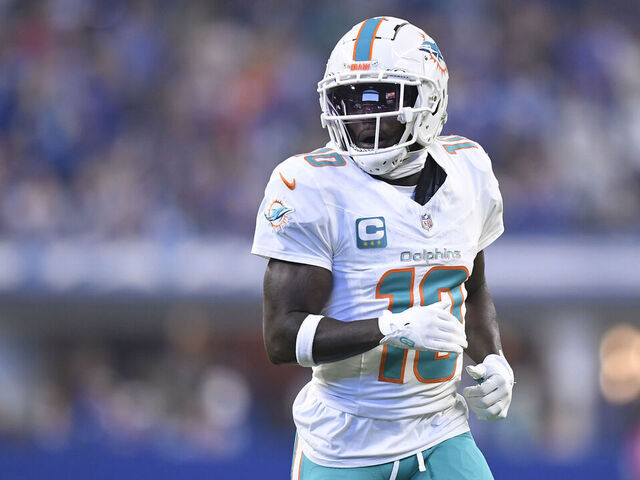 INDIANAPOLIS, IN - OCTOBER 20: Miami Dolphins Wide Receiver Tyreek Hill (10) jogs across the field during the NFL game between the Miami Dolphins and the Indianapolis Colts on October 20, 2024, at Lucas Oil Stadium in Indianapolis, Indiana.