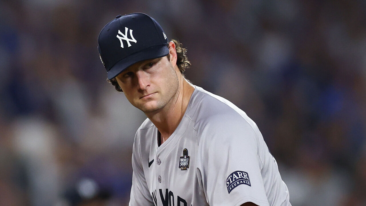 LOS ANGELES, CALIFORNIA - OCTOBER 25: Gerrit Cole #45 of the New York Yankees reacts after Enrique Hernandez #8 of the Los Angeles Dodgers hit a triple in the fifth inning during Game One of the 2024 World Series at Dodger Stadium on October 25, 2024 in Los Angeles, California.