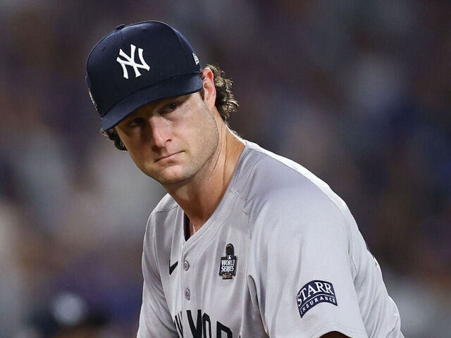LOS ANGELES, CALIFORNIA - OCTOBER 25: Gerrit Cole #45 of the New York Yankees reacts after Enrique Hernandez #8 of the Los Angeles Dodgers hit a triple in the fifth inning during Game One of the 2024 World Series at Dodger Stadium on October 25, 2024 in Los Angeles, California.