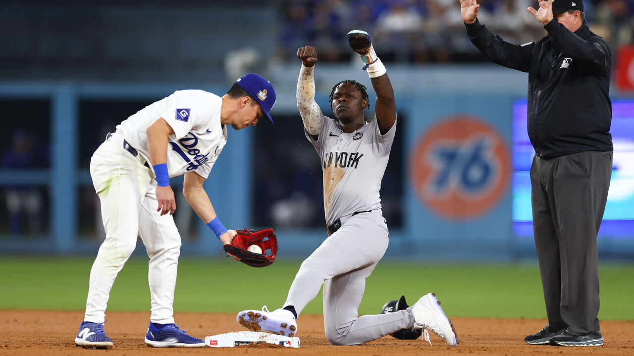 LOS ANGELES, CALIFORNIA - OCTOBER 25: Jazz Chisholm Jr. #13 of the New York Yankees steals second base in the tenth inning against the Los Angeles Dodgers during Game One of the 2024 World Series at Dodger Stadium on October 25, 2024 in Los Angeles, California.