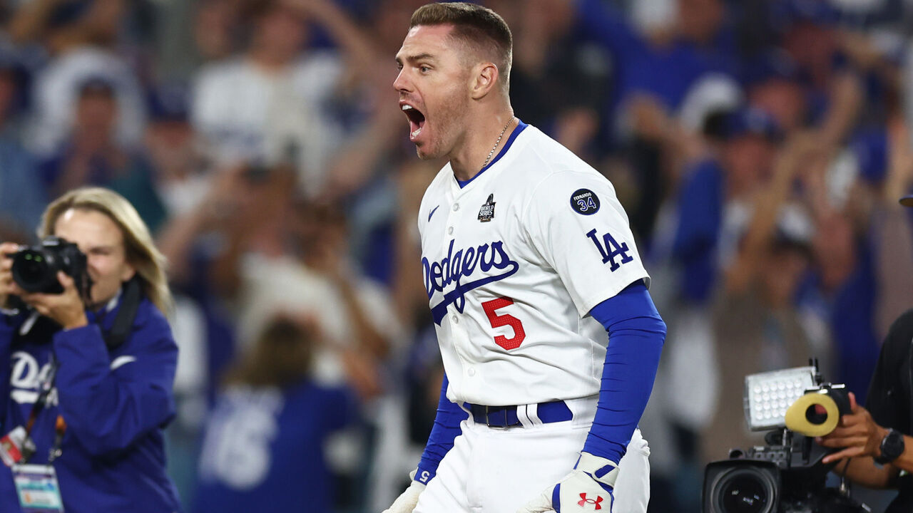 LOS ANGELES, CALIFORNIA - OCTOBER 25: Freddie Freeman #5 of the Los Angeles Dodgers celebrates after hitting a walk-off grand slam during the tenth inning against the New York Yankees during Game One of the 2024 World Series at Dodger Stadium on October 25, 2024 in Los Angeles, California.