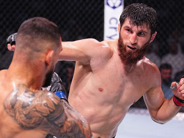 ABU DHABI, UNITED ARAB EMIRATES - OCTOBER 26: (R-L) Magomed Ankalaev of Russia punches Aleksandar Rakic of Austria in a light heavyweight fight during the UFC 308 event at Etihad Arena on October 26, 2024 in Abu Dhabi, United Arab Emirates.