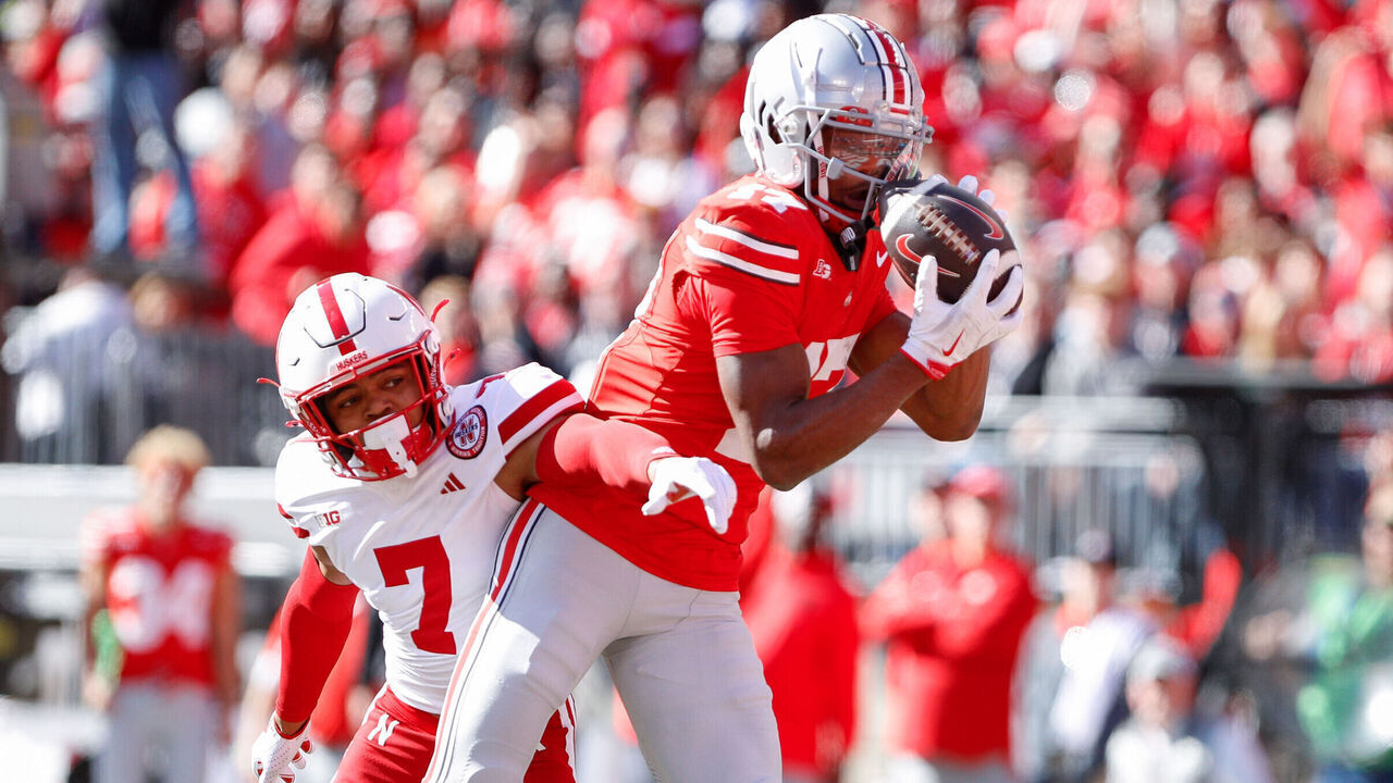 COLUMBUS, OH - OCTOBER 26: Ohio State Buckeyes wide receiver Carnell Tate (17) catches a touchdown while being defended by Nebraska Cornhuskers defensive back Malcolm Hartzog Jr. (7) during the game against the Nebraska Cornhuskers and the Ohio State Buckeyes on October 26, 2024, at Ohio Stadium in Columbus, OH.