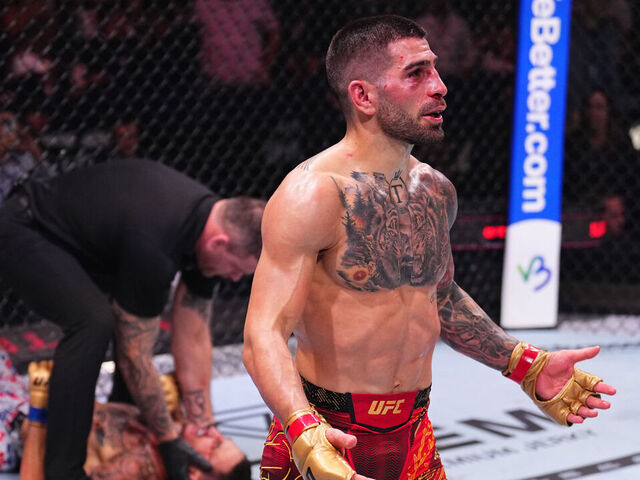 ABU DHABI, UNITED ARAB EMIRATES - OCTOBER 26: Ilia Topuria of Spain reacts after a knockout victory against Max Holloway in the UFC featherweight championship fight during the UFC 308 event at Etihad Arena on October 26, 2024 in Abu Dhabi, United Arab Emirates.