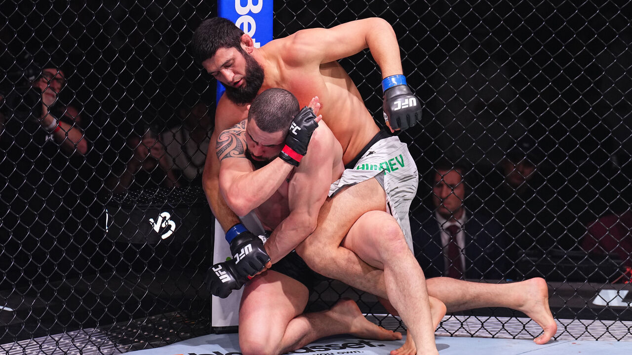 ABU DHABI, UNITED ARAB EMIRATES - OCTOBER 26: (R-L) Khamzat Chimaev of Russia punches Robert Whittaker of New Zealand in a middleweight fight during the UFC 308 event at Etihad Arena on October 26, 2024 in Abu Dhabi, United Arab Emirates.