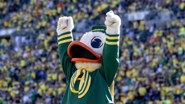 EUGENE, OREGON - OCTOBER 26: Puddles the mascot of the Oregon Ducks cheers against the Illinois Fighting Illini during the first half at Autzen Stadium on October 26, 2024 in Eugene, Oregon.