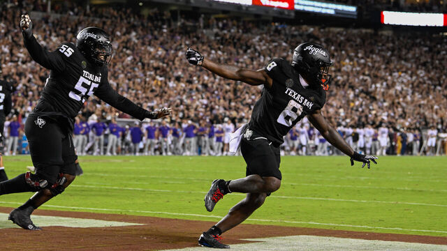 COLLEGE STATION, TX - OCTOBER 26: Texas A&M Aggies running back Le'Veon Moss (8) celebrates his first half rushing touchdown with Texas A&M Aggies offensive lineman Ar'maj Reed-Adams (55) during the football game between the LSU Tigers and Texas A&M Aggies on October 26, 2024 at Kyle Field in College Station, Texas.