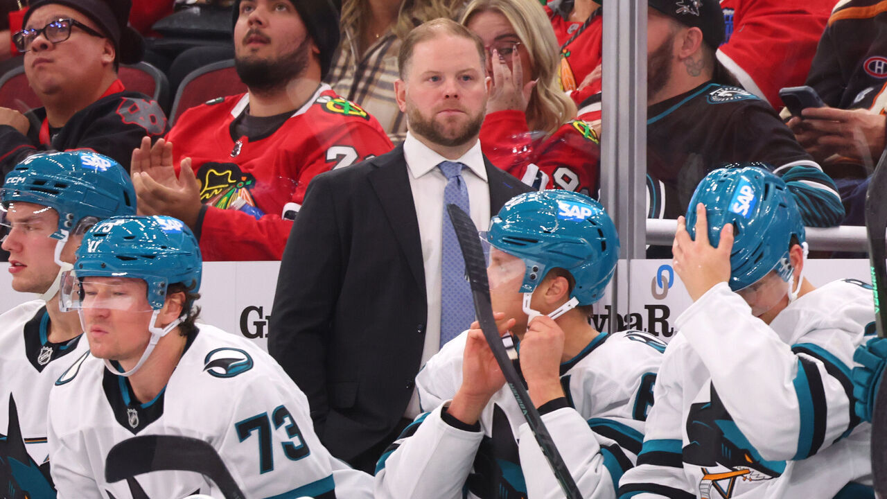 CHICAGO, ILLINOIS - OCTOBER 17: Head coach Ryan Warsofsky of the San Jose Sharks looks on against the Chicago Blackhawks during the second period at the United Center on October 17, 2024 in Chicago, Illinois.