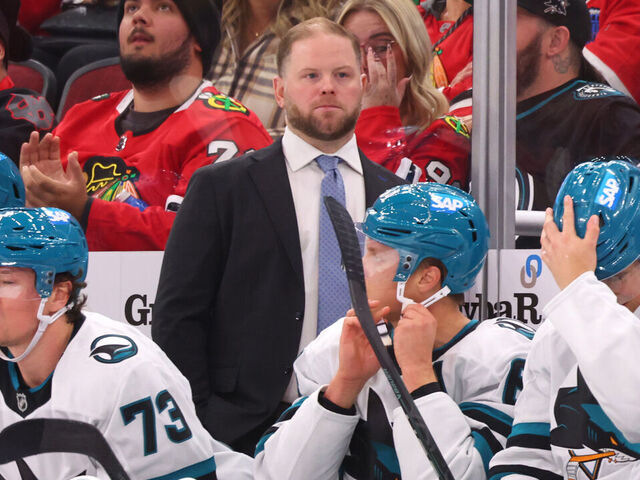 CHICAGO, ILLINOIS - OCTOBER 17: Head coach Ryan Warsofsky of the San Jose Sharks looks on against the Chicago Blackhawks during the second period at the United Center on October 17, 2024 in Chicago, Illinois.