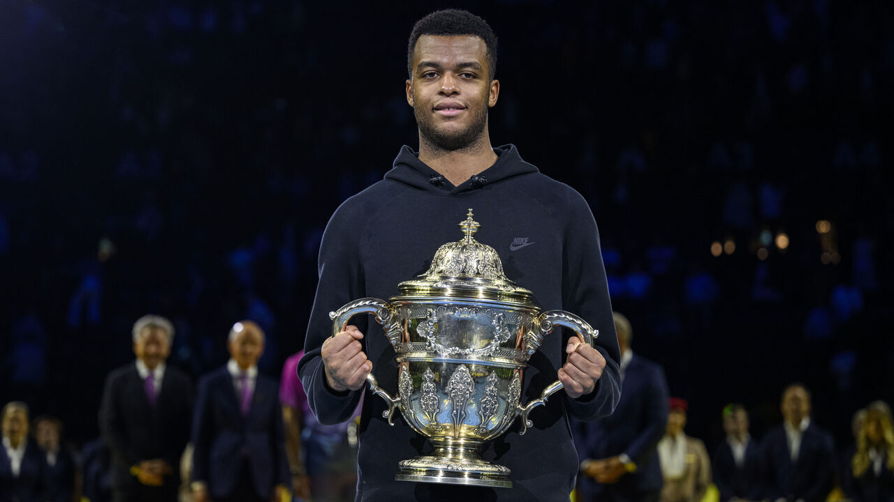 BASEL, SWITZERLAND - OCTOBER 27: Giovanni Mpetshi Perricard of France poses for photos with his men's singles winner trophy after his match against Ben Shelton of USA during the Swiss Indoors Basel - Day 7 at St. Jakobshalle on October 27, 2024 in Basel, Switzerland.