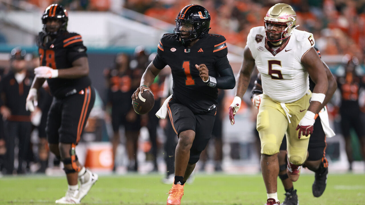 MIAMI GARDENS, FLORIDA - OCTOBER 26: Cam Ward #1 of the Miami Hurricanes scrambles against the Florida State Seminoles during the second half at Hard Rock Stadium on October 26, 2024 in Miami Gardens, Florida.