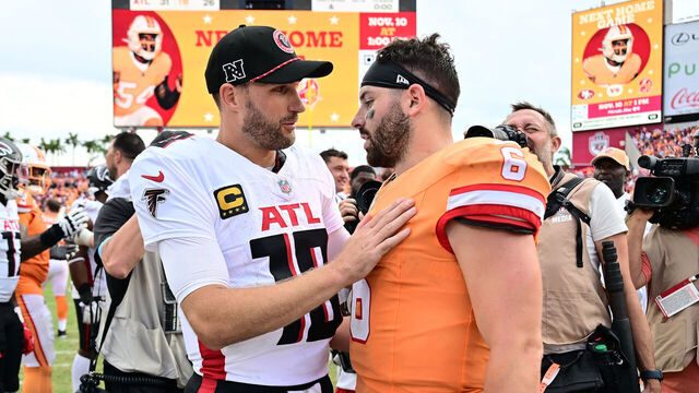 TAMPA, FLORIDA - OCTOBER 27: Kirk Cousins #18 of the Atlanta Falcons converses with Baker Mayfield #6 of the Tampa Bay Buccaneers after their 31-26 win at Raymond James Stadium on October 27, 2024 in Tampa, Florida.