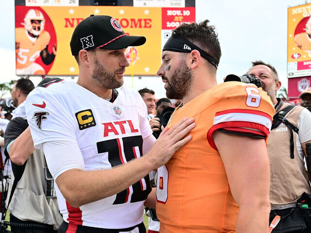 TAMPA, FLORIDA - OCTOBER 27: Kirk Cousins #18 of the Atlanta Falcons converses with Baker Mayfield #6 of the Tampa Bay Buccaneers after their 31-26 win at Raymond James Stadium on October 27, 2024 in Tampa, Florida.