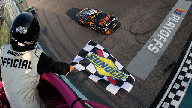 HOMESTEAD, FLORIDA - OCTOBER 27: Tyler Reddick, driver of the #45 The Beast Killer Sunrise Toyota, takes the checkered flag to win the NASCAR Cup Series Straight Talk Wireless 400 at Homestead-Miami Speedway on October 27, 2024 in Homestead, Florida.