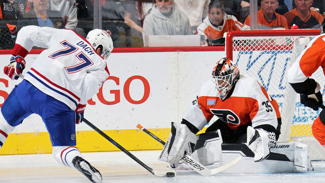PHILADELPHIA, PENNSYLVANIA - OCTOBER 27: Aleksei Kolosov #35 of the Philadelphia Flyers protects his net against a scoring chance by Kirby Dach #77 of the Montreal Canadiens at the Wells Fargo Center on October 27, 2024 in Philadelphia, Pennsylvania.