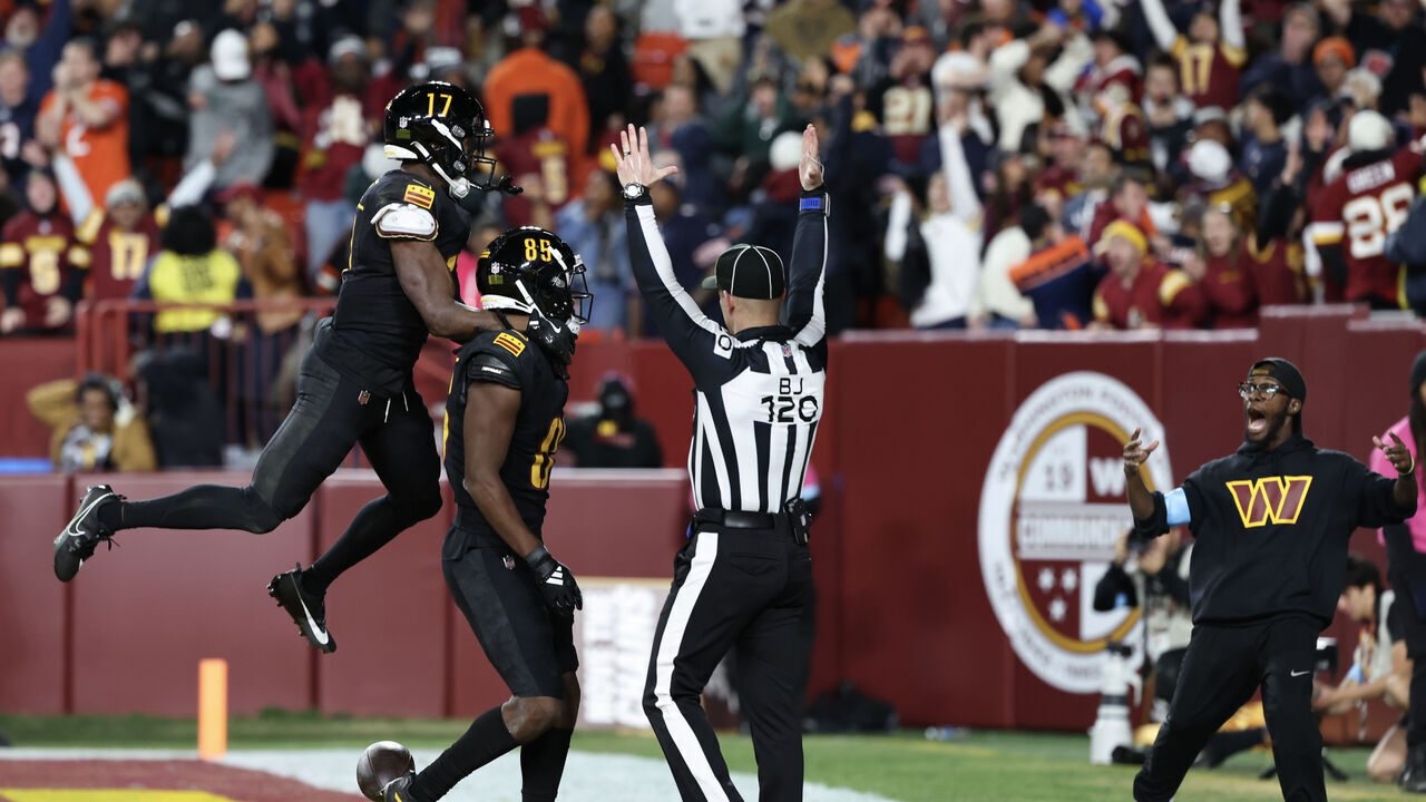 LANDOVER, MARYLAND - OCTOBER 27: Noah Brown #85 of the Washington Commanders celebrates his game winning touchdown reception against the Chicago Bears with Terry McLaurin #17 at Northwest Stadium on October 27, 2024 in Landover, Maryland.