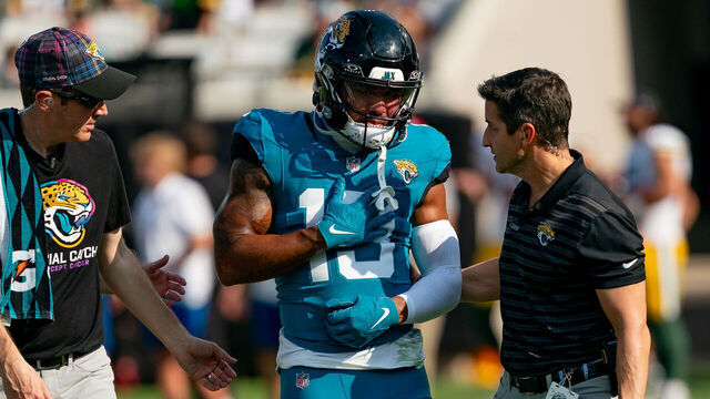 JACKSONVILLE, FL - OCTOBER 27: Jacksonville Jaguars wide receiver Christian Kirk (13) is helped off the field after an injury during a NFL football game between the Green Bay Packers and the Jacksonville Jaguars on October 27th, 2024 at EverBank Stadium in Jacksonville, FL.