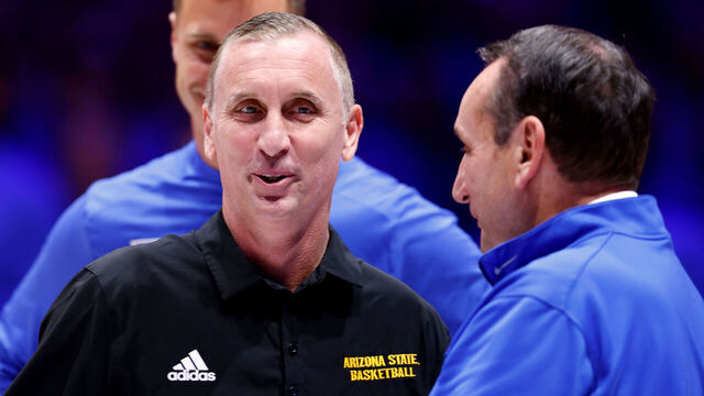 DURHAM, NORTH CAROLINA - OCTOBER 27: Head coach Bobby Hurley (L) of the Arizona State Sun Devils smiles while talking with Duke University ambassador Mike Krzyzewski prior to their exhibition game against the Duke Blue Devils at Cameron Indoor Stadium on October 27, 2024 in Durham, North Carolina.