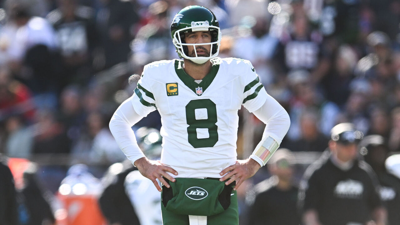 FOXBOROUGH, MASSACHUSETTS - OCTOBER 27: Aaron Rodgers #8 of the New York Jets stands on the field against the New England Patriots in the first quarter at Gillette Stadium on October 27, 2024 in Foxborough, Massachusetts.