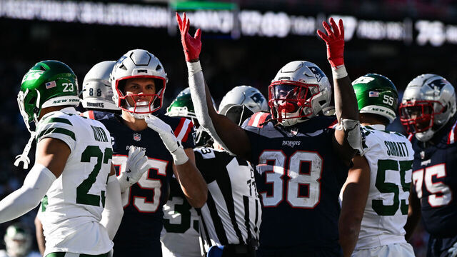 FOXBOROUGH, MASSACHUSETTS - OCTOBER 27: Rhamondre Stevenson #38 of the New England Patriots reacts after scoring a touchdown against the New York Jets in the third quarter at Gillette Stadium on October 27, 2024 in Foxborough, Massachusetts.