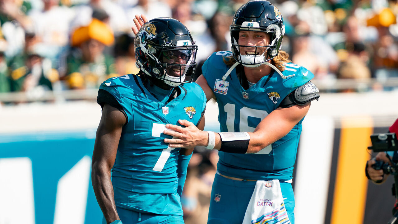 JACKSONVILLE, FL - OCTOBER 27: Jacksonville Jaguars quarterback Trevor Lawrence (16) and Jacksonville Jaguars wide receiver Brian Thomas Jr. (7) celebrate after a touchdown during a NFL football game between the Green Bay Packers and the Jacksonville Jaguars on October 27th, 2024 at EverBank Stadium in Jacksonville, FL.
