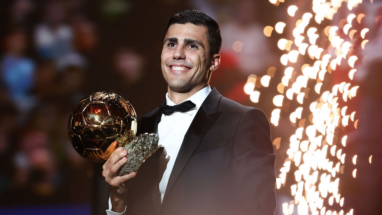 Manchester City's Spanish midfielder Rodri receives the Ballon d'Or award during the 2024 Ballon d'Or France Football award ceremony at the Theatre du Chatelet in Paris on October 28, 2024.